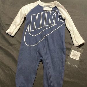 7 Nike onesies